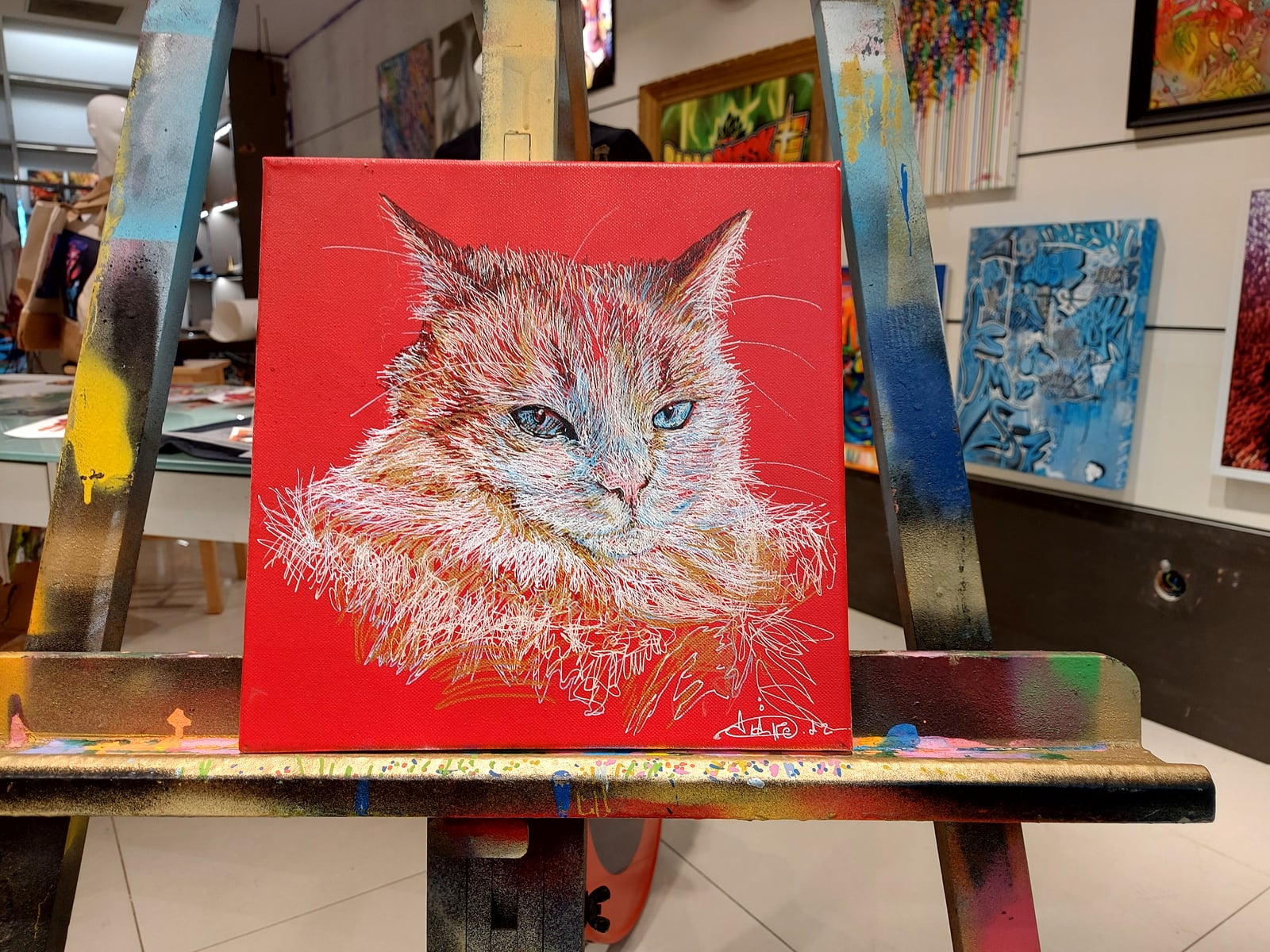 Petite toile carrée — chat blanc tracé fin sur fond rouge